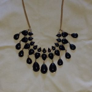 Yellow metal necklace with black beads